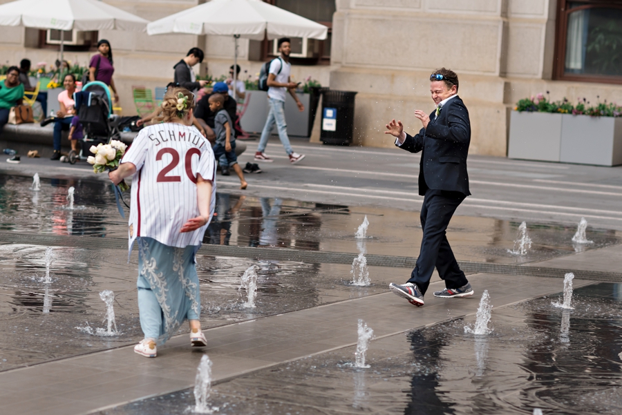 A bride splashed her groom with water from the fountain at Dilworth Park in Philly.